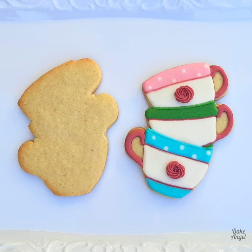 Vegan no-chill sugar cookies on a white tray, one undecorated and one decorated with royal icing, perfect for detailed decorating.