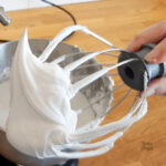 Close up of freshly whipped vegan royal icing showing the medium peak.