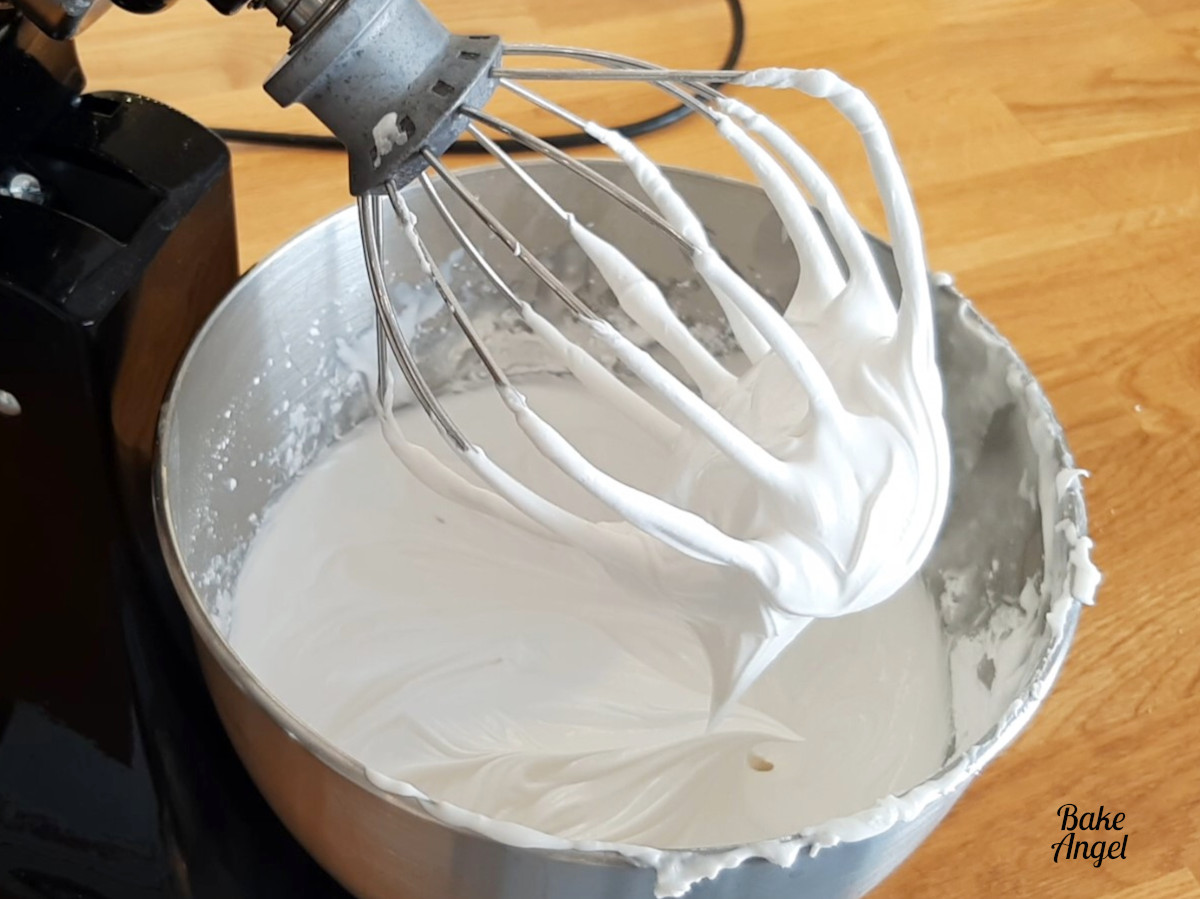 Showing freshly made vegan royal icing in a stand mixer. 
