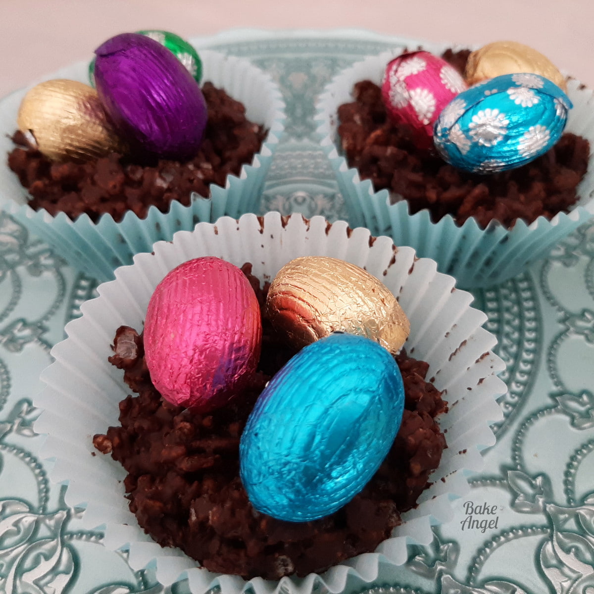 Close up of Easter birds nest chocolate cereal with foil mini eggs. treats