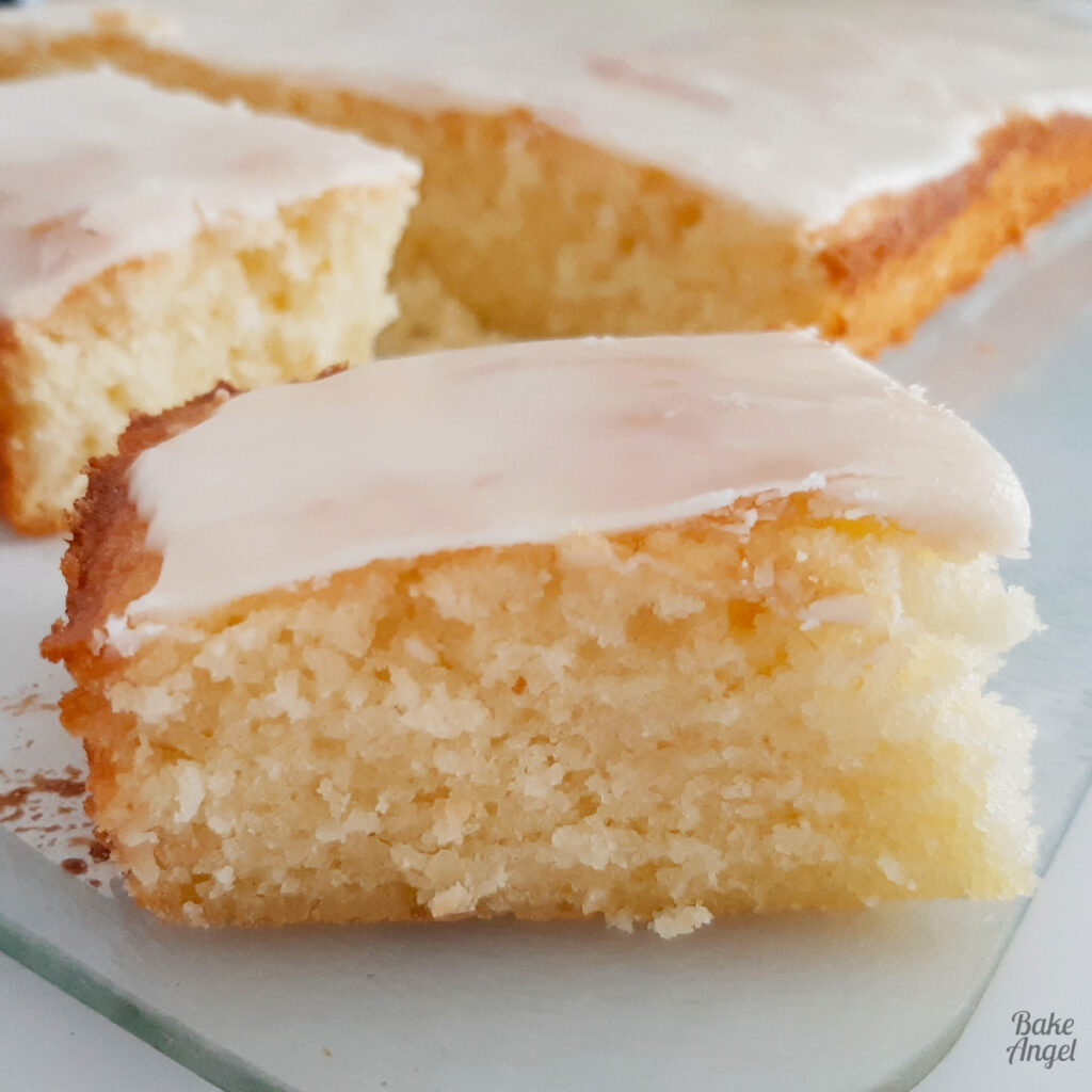 Bite-sized coconut orange traybake squares, light citrus dessert perfect for summer picnics and BBQs.