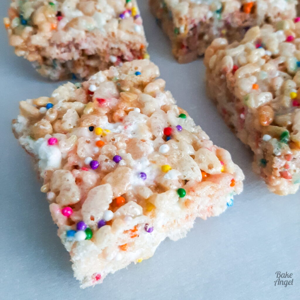 Chewy rice krispie squares cut into squares, nostalgic no-bake dessert perfect for summer BBQs and picnics.