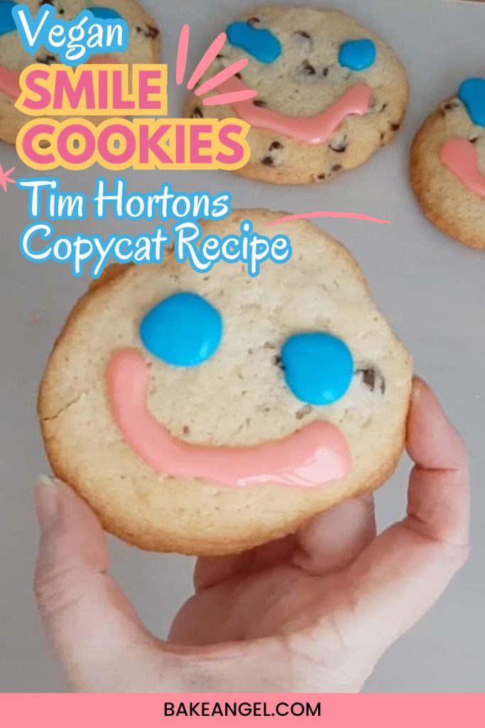 A selection of Vegan Smile Cookies (Tim Hortons Copycat recipe) on parchment paper.