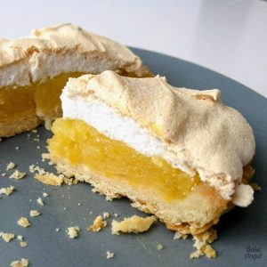 Close up of a slice of lemon meringue pie.