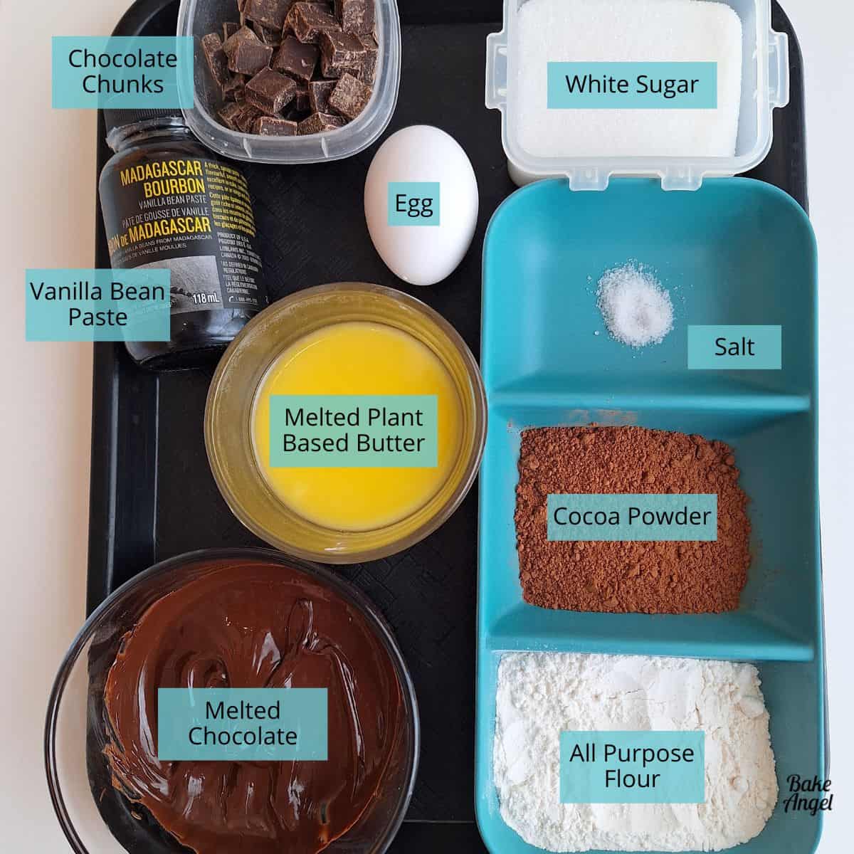 A selection of containers with 9 ingredients needed to make copycat two bite brownies.