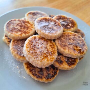 Close up of a stack of Vegan Welsh Cakes on a white plate.