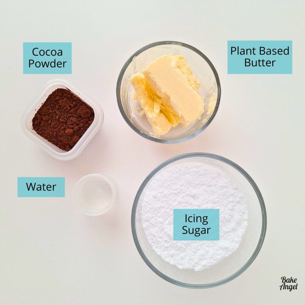 Ingredients to make a small batch of chocolate buttercream: butter, icing sugar, cocoa powder, and water.