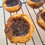 Close up of a baked vegan maple butter tart.