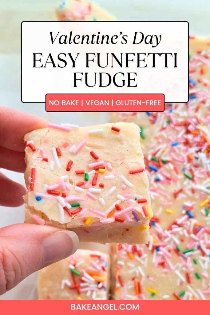 Close up of a square of Valentine's Day Easy Funfetti Fudge being held over a board of fudge.