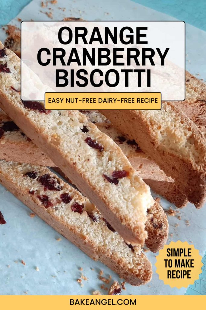 Slices of nut free dairy free orange cranberry biscotti on a blue tray.