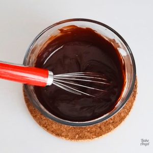 A small batch of Dairy Free Chocolate Ganache, with a whisk in the bowl.
