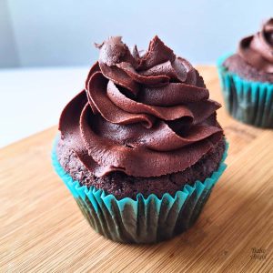 A chocolate cupcake frosted with Stable Dairy-Free Chocolate Buttercream.