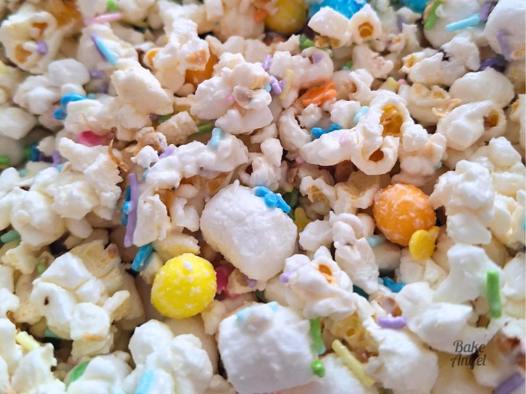 Close up of Easter bunny bait popcorn showing chocolate coating and sprinkles.