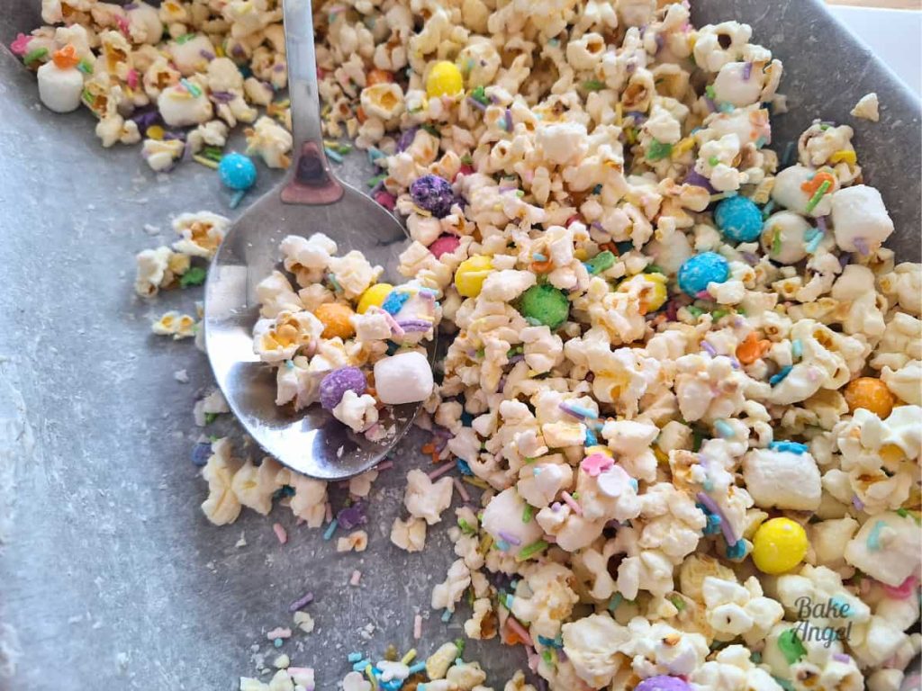 Close up of Bunny Bait popcorn with a serving spoon.