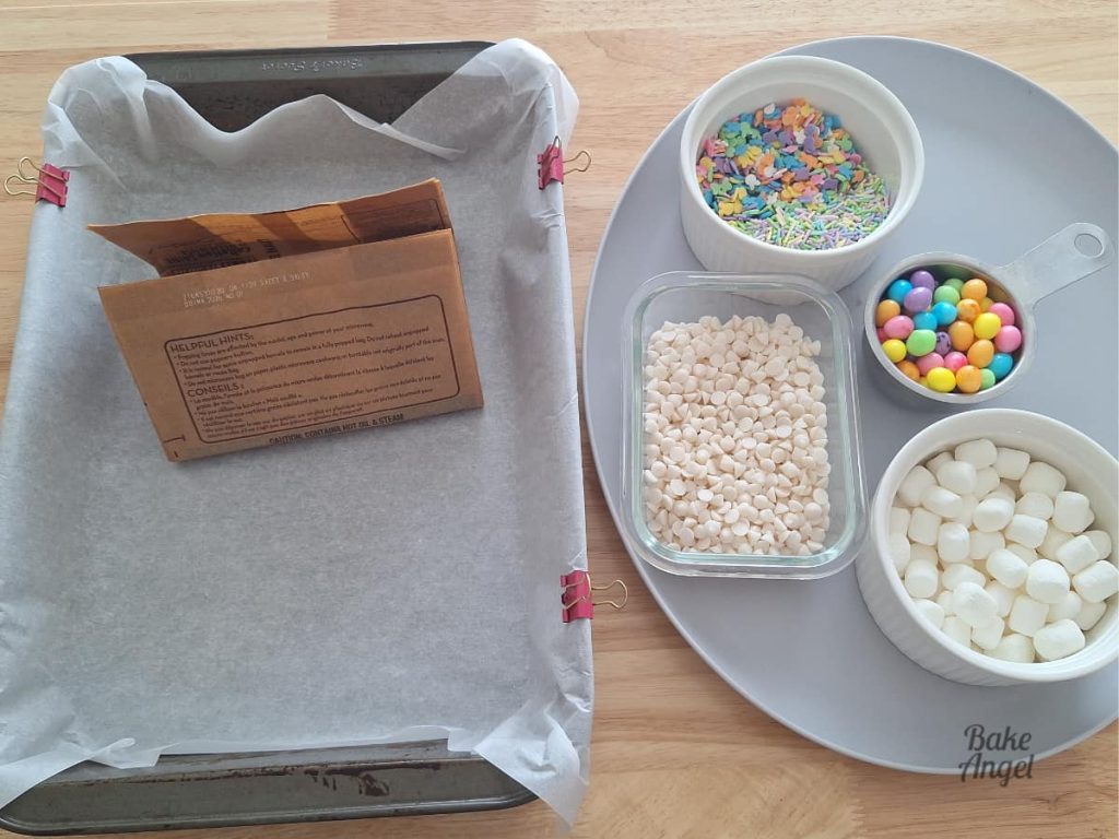 Popcorn and ingredients laid out to make Easter Bunny Bait popcorn recipe.