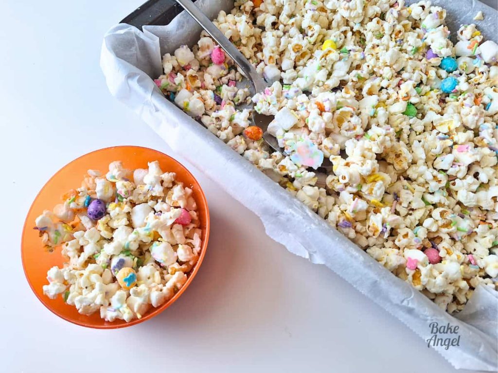 Bowl of Easter Bunny Bait popcorn with marshmallows and pastel candies.