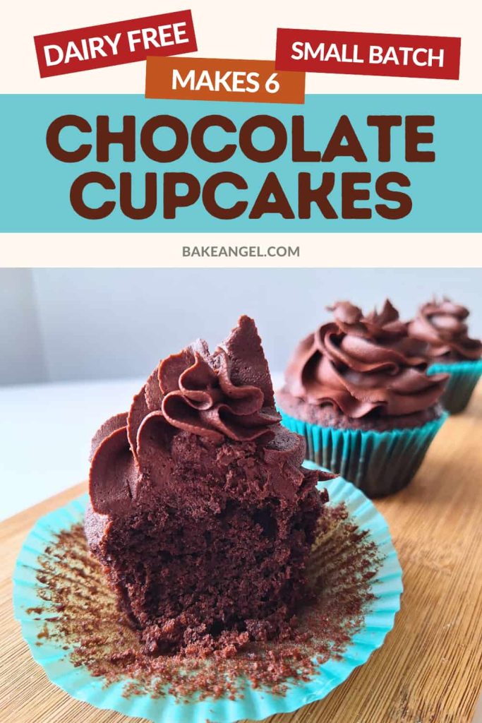 Close up of a chocolate cupcakes frosted with buttercream with a large bite taken from the front.