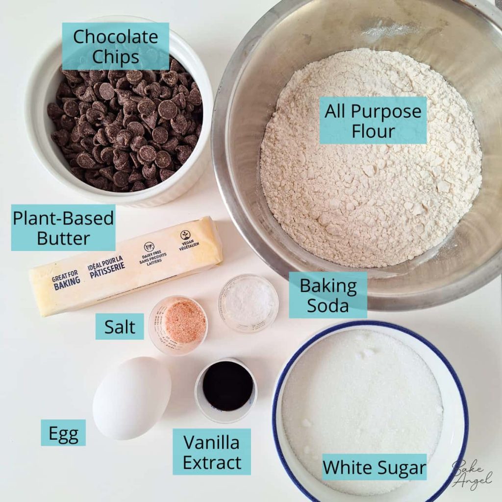 Ingredients for chocolate chip cookie cake: chocolate chips, flour, butter, salt, baking soda, egg, vanilla extract and white sugar.