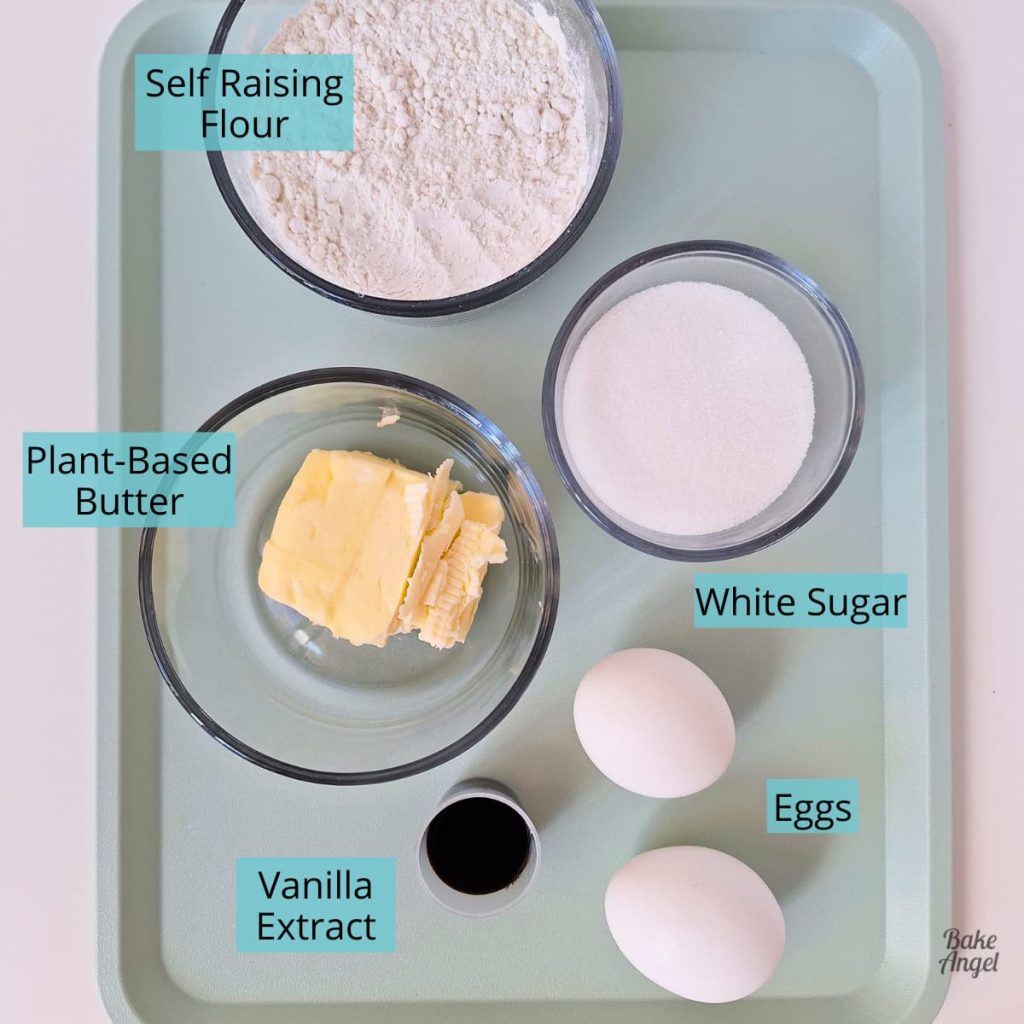 Ingredients for dairy free peach upside down cake including flour, sugar, eggs, vanilla and plant based butter.