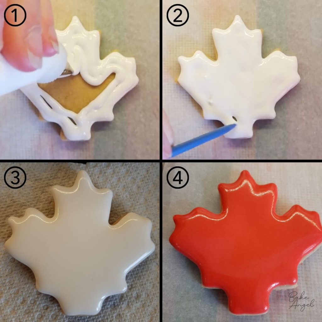 Flooding a maple leaf sugar cookie with white royal icing.