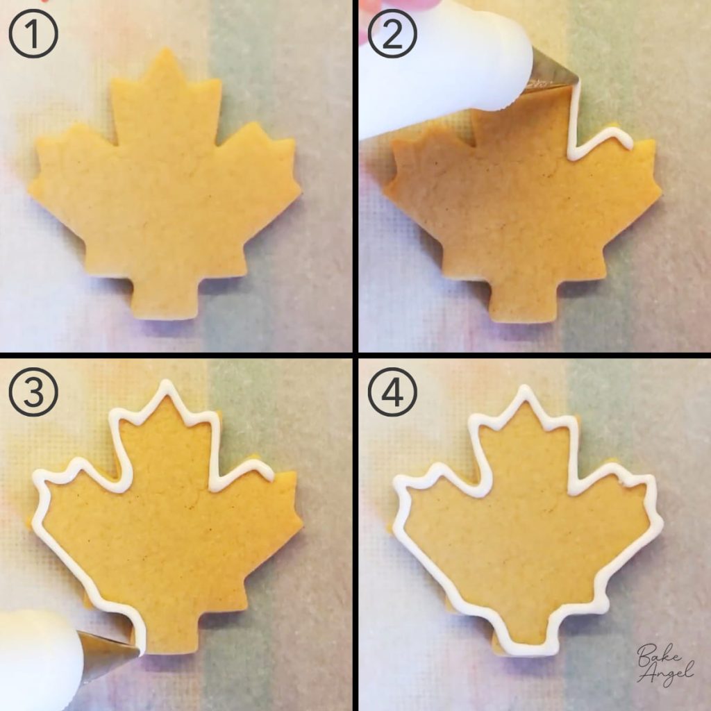 Outlining a maple leaf sugar cookie with white royal icing.