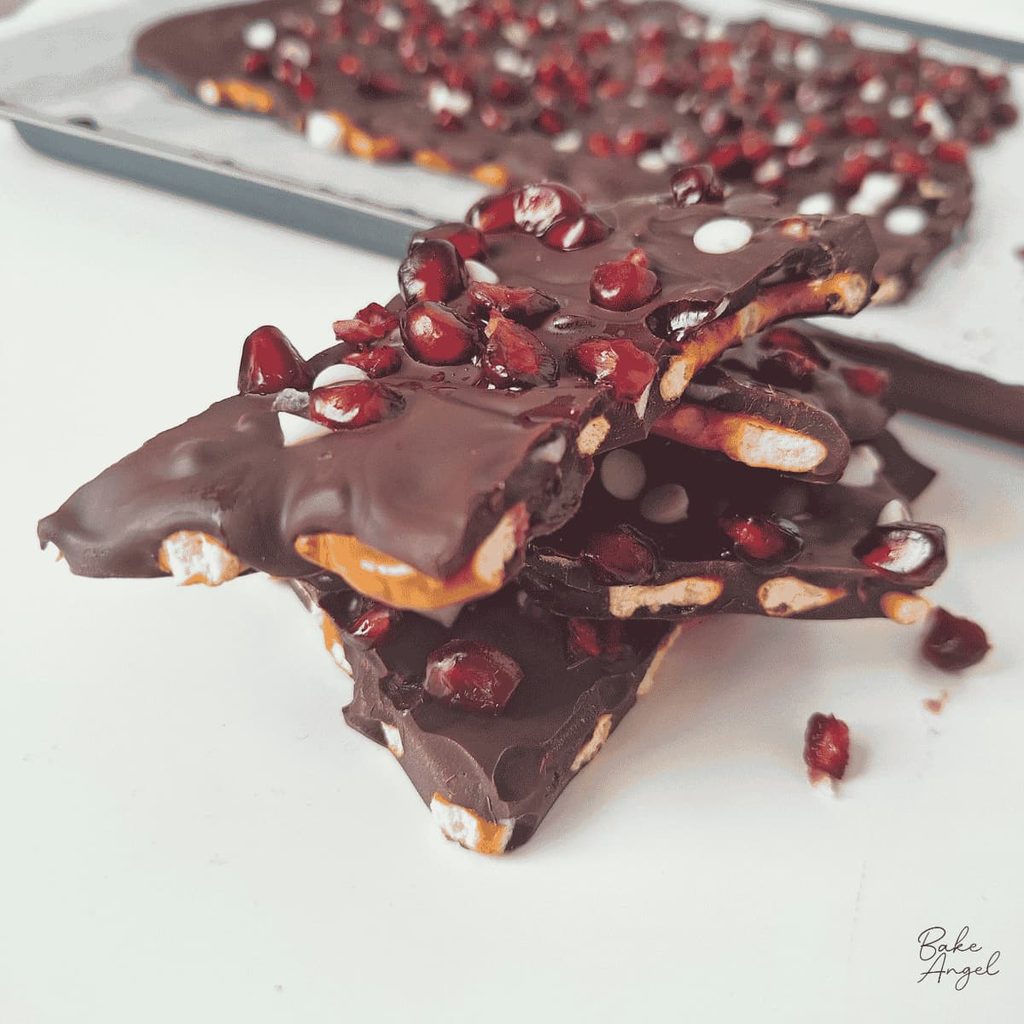 Close up of pieces of vegan pomegranate pretzel bark.