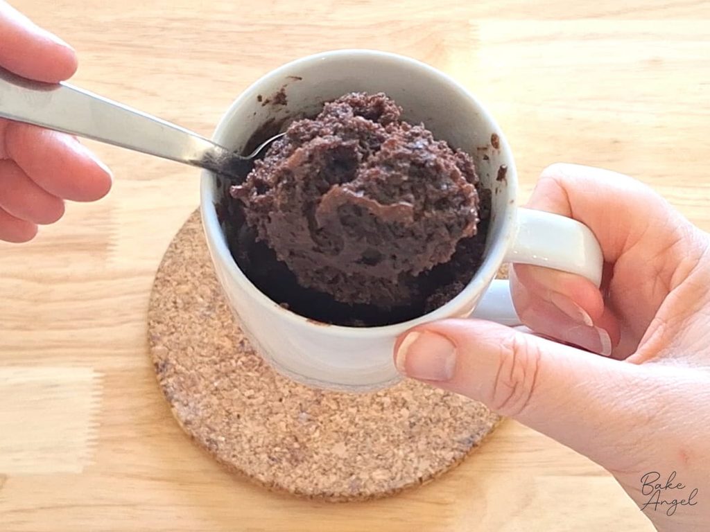 Soft chocolate mug cake with a rich, moist centre, ready to enjoy straight from the mug.
