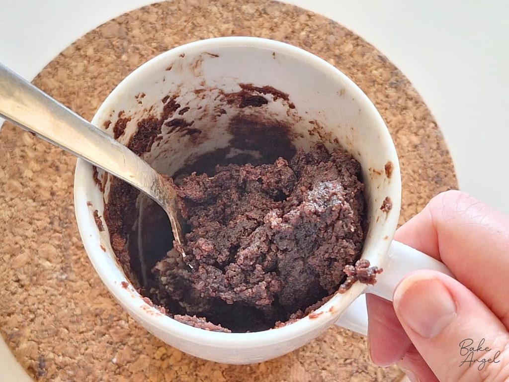 Freshly made chocolate mug cake ready to enjoy as a quick single-serving dessert.