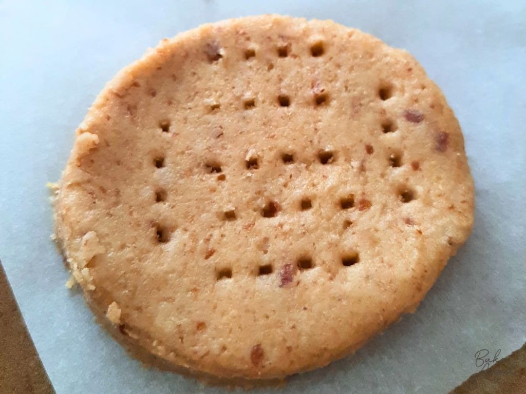 Close up of a digestive biscuit with the fork design prior to baking.