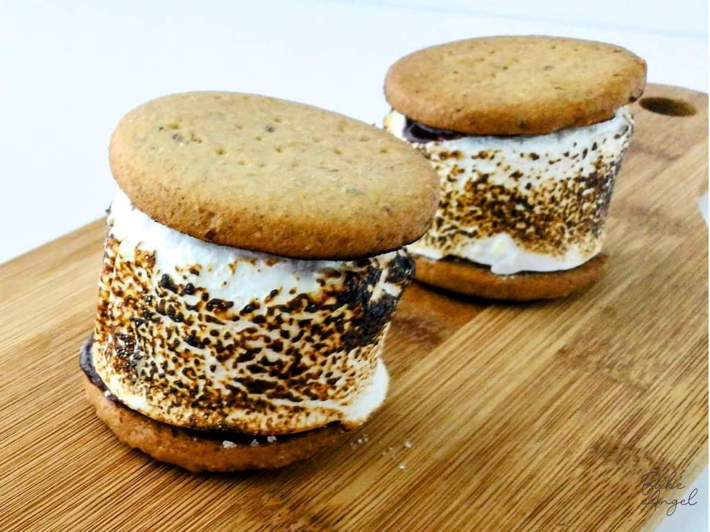 Close up of two homemade s'mores with toasted marshmallows.